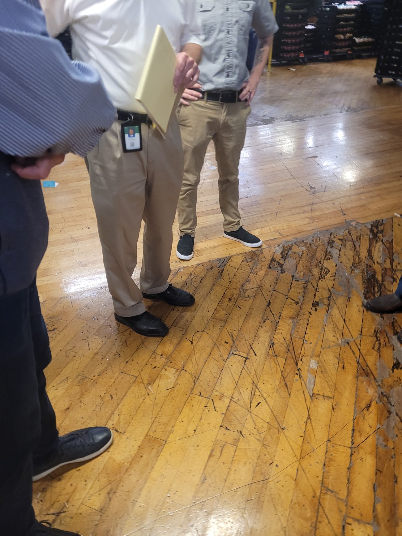 On-site assessment of a damaged commercial hardwood floor in Portland